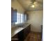 Kitchen showcasing practical layout, wood cabinets, tile floors, and updated appliances at 8155 W Desert Cove Ave, Peoria, AZ 85345
