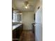 Cozy kitchen features tile floor, lighter countertops and wood cabinets at 8155 W Desert Cove Ave, Peoria, AZ 85345