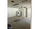 Living room featuring carpet, a ceiling fan, a refrigerator and shelves at 8155 W Desert Cove Ave, Peoria, AZ 85345