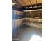 Spacious shed interior with built-in shelving for organized storage solutions at 8155 W Desert Cove Ave, Peoria, AZ 85345