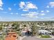 Aerial view of neighborhood featuring well-maintained homes with red tile roofs, mature trees, and desert landscaping at 8361 E San Rafael Dr, Scottsdale, AZ 85258