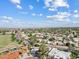Panoramic aerial view showcasing the neighborhood with tree-lined streets, tile roofs, and desert landscape at 8361 E San Rafael Dr, Scottsdale, AZ 85258