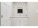 Neutral bathroom with a white vanity and well-lit mirror at 8361 E San Rafael Dr, Scottsdale, AZ 85258