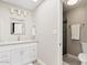 Bright bathroom featuring a granite-top vanity and glass-enclosed shower at 8361 E San Rafael Dr, Scottsdale, AZ 85258