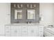 Bathroom with dual sinks, granite counters and stylish backsplash at 8361 E San Rafael Dr, Scottsdale, AZ 85258