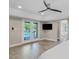Bedroom with patio access to a swimming pool and modern ceiling fan at 8361 E San Rafael Dr, Scottsdale, AZ 85258