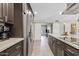 Beautiful kitchen with stainless steel refrigerator, updated cabinets, and granite countertops at 8361 E San Rafael Dr, Scottsdale, AZ 85258