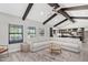 Open living room area featuring vaulted ceilings and exposed wooden beams at 8361 E San Rafael Dr, Scottsdale, AZ 85258