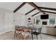 Beautiful great room with wood beams, fireplace, and multiple seating areas at 8361 E San Rafael Dr, Scottsdale, AZ 85258