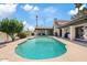Beautiful pool and backyard area featuring well-maintained landscaping and a covered patio for comfortable outdoor living at 8361 E San Rafael Dr, Scottsdale, AZ 85258
