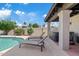 Outdoor patio with lounge chairs and hot tub area, ideal for relaxation and enjoying the backyard oasis at 8361 E San Rafael Dr, Scottsdale, AZ 85258