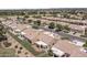 Residential community with well-maintained streets, desert landscaping, and tile roofs at 8431 W Utopia Rd, Peoria, AZ 85382