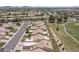 Planned community featuring lush landscaping, well-maintained homes, and scenic streets at 8431 W Utopia Rd, Peoria, AZ 85382