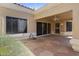 Covered back patio with ceiling fan provides relaxing view of the backyard at 8431 W Utopia Rd, Peoria, AZ 85382