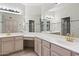 Bright bathroom featuring double sinks, ample storage, and a vanity area at 8431 W Utopia Rd, Peoria, AZ 85382