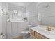 Accessible bathroom featuring a walk-in tub, a vanity, and safety features at 8431 W Utopia Rd, Peoria, AZ 85382