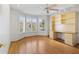 Bright bedroom features hardwood floors, built-in shelves, and large windows with shutter coverings at 8431 W Utopia Rd, Peoria, AZ 85382
