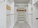 Walk-in closet with custom shelving and ample storage space at 8431 W Utopia Rd, Peoria, AZ 85382