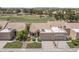 Charming single-story home featuring a tile roof, manicured lawn, and a two-car garage at 8431 W Utopia Rd, Peoria, AZ 85382