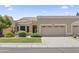 Charming single-story home with well-manicured front yard and attached two-car garage at 8431 W Utopia Rd, Peoria, AZ 85382