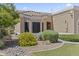 Lovely home with desert landscaping and a flowing river rock bed at 8431 W Utopia Rd, Peoria, AZ 85382