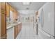 Bright kitchen featuring tiled floor, updated cabinets, stainless appliances and breakfast nook at 8431 W Utopia Rd, Peoria, AZ 85382