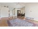 Open-concept living room with hardwood floors and ample natural light at 8431 W Utopia Rd, Peoria, AZ 85382