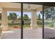 View from covered patio of lush backyard and scenic golf course beyond at 8431 W Utopia Rd, Peoria, AZ 85382