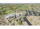 Stunning aerial view of a building near a golf course with lush greenery and surrounding desert landscape at 10222 E Southwind Ln # 1018, Scottsdale, AZ 85262