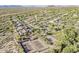 Aerial view featuring community tennis courts, houses, desert landscaping, and mountain views at 10222 E Southwind Ln # 1018, Scottsdale, AZ 85262