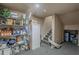 Basement storage room with shelving and stairs at 10222 E Southwind Ln # 1018, Scottsdale, AZ 85262