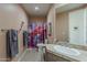 Bathroom with bright shower curtain, tile flooring, and countertop at 10222 E Southwind Ln # 1018, Scottsdale, AZ 85262