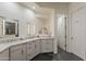 Bathroom featuring elegant countertops, contemporary mirrors, and abundant cabinet space at 10222 E Southwind Ln # 1018, Scottsdale, AZ 85262