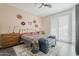 Well-lit bedroom featuring neutral colors, stylish décor, and ample natural light through white shutters at 10222 E Southwind Ln # 1018, Scottsdale, AZ 85262