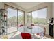 Bright dining area with a marble table, red chairs, and beautiful outdoor views at 10222 E Southwind Ln # 1018, Scottsdale, AZ 85262