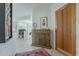 Bright foyer with a wooden door, stylish console table, and seamless access to the living area at 10222 E Southwind Ln # 1018, Scottsdale, AZ 85262