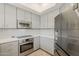 Modern kitchen featuring stainless steel appliances, gray cabinetry, and stylish design at 10222 E Southwind Ln # 1018, Scottsdale, AZ 85262