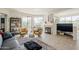 Spacious living room with large windows, cozy seating, and a fireplace at 10222 E Southwind Ln # 1018, Scottsdale, AZ 85262