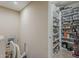 Organized walk-in pantry with ample shelving space for food storage and kitchen essentials at 10222 E Southwind Ln # 1018, Scottsdale, AZ 85262