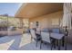 Comfortable outdoor dining area with a built-in grill and view of the surrounding community at 10222 E Southwind Ln # 1018, Scottsdale, AZ 85262