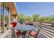 Outdoor patio with dining table and seating, plus grill and desert views at 10222 E Southwind Ln # 1018, Scottsdale, AZ 85262