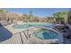 Beautiful pool and spa surrounded by desert landscape with a secure fence for safety and privacy at 10222 E Southwind Ln # 1018, Scottsdale, AZ 85262