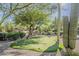 Lush putting green featuring manicured landscaping, mature trees, and native desert plants at 10222 E Southwind Ln # 1018, Scottsdale, AZ 85262
