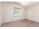 Bedroom showcasing carpet, a ceiling fan, and a window with drapes and blinds at 10845 W Manzanita Dr, Peoria, AZ 85345