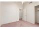 Bedroom showing carpet, a ceiling fan, and a view into a closet at 10845 W Manzanita Dr, Peoria, AZ 85345