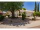Attractive desert landscaping frames this well-maintained single-story home and two car garage at 10845 W Manzanita Dr, Peoria, AZ 85345