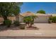 Charming single-story home with desert landscaping, palm trees, and a two-car garage at 10845 W Manzanita Dr, Peoria, AZ 85345