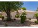 Attractive desert landscaping frames this well-maintained single-story home and two car garage at 10845 W Manzanita Dr, Peoria, AZ 85345