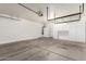 Spacious garage featuring storage shelves and cabinets at 10845 W Manzanita Dr, Peoria, AZ 85345