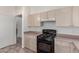 Bright kitchen features an oven with gas range and light-colored cabinets at 10845 W Manzanita Dr, Peoria, AZ 85345